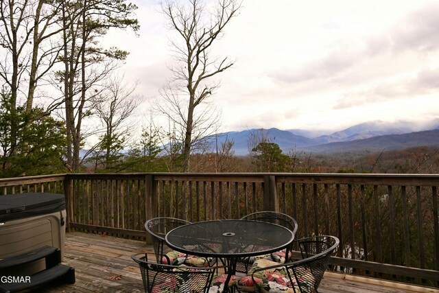 wooden terrace with a mountain view