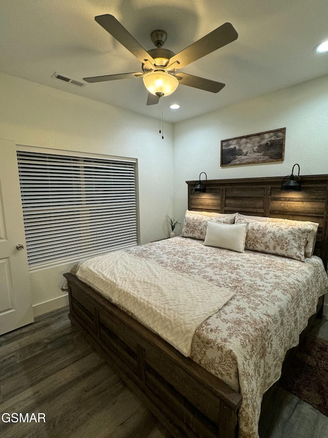 bedroom with ceiling fan, recessed lighting, and dark wood finished floors