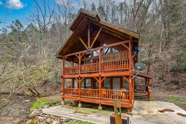 view of outbuilding featuring a forest view