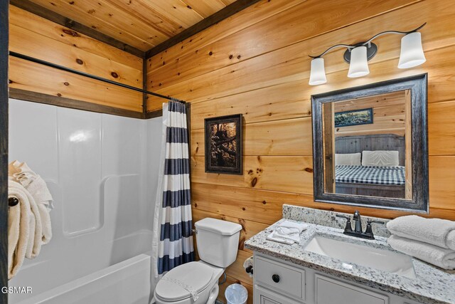 4541 Shangrila Way, Sevierville, TN 37876 - full bath with wood ceiling, wood walls, vanity, toilet, and shower / bathtub combination with curtain