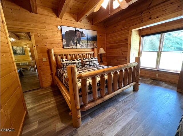 311 Caney Creek Rd, Pigeon Forge, TN 37863 - bedroom with wood walls, wood finished floors, and a wood ceiling with exposed beams