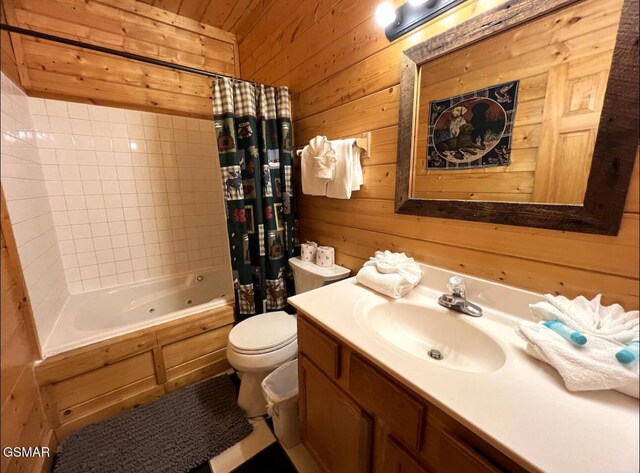 311 Caney Creek Rd, Pigeon Forge, TN 37863 - bathroom with vanity, wooden walls, and a combined bath / shower with jetted tub