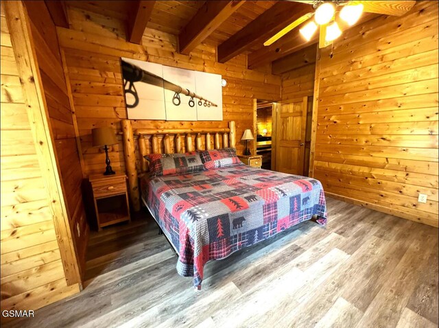 311 Caney Creek Rd, Pigeon Forge, TN 37863 - bedroom with wood finished floors, wooden walls, and a wood ceiling with exposed beams