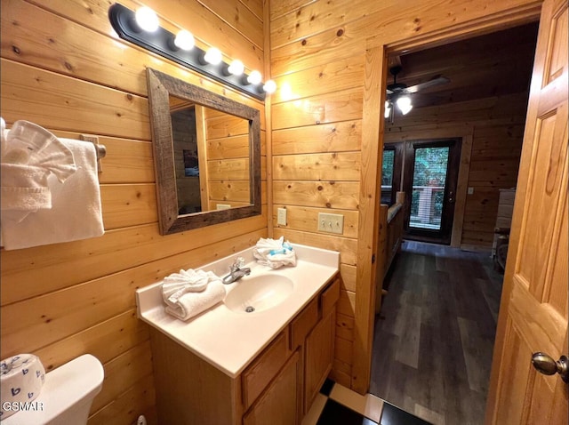 311 Caney Creek Rd, Pigeon Forge, TN 37863 - bathroom with wooden walls, vanity, wood finished floors, and ceiling fan