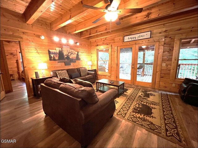 311 Caney Creek Rd, Pigeon Forge, TN 37863 - living area with wooden walls, a wood ceiling with exposed beams, wood finished floors, a ceiling fan, and french doors