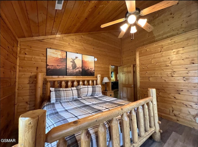 311 Caney Creek Rd, Pigeon Forge, TN 37863 - bedroom with wood ceiling, wood walls, wood finished floors, lofted ceiling, and a ceiling fan