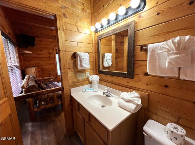 311 Caney Creek Rd, Pigeon Forge, TN 37863 - half bath with vanity, wooden walls, and wood finished floors