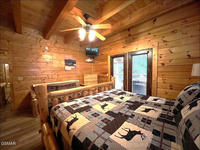 311 Caney Creek Rd, Pigeon Forge, TN 37863 - bedroom featuring wood walls, a wooden ceiling with exposed beams, and wood finished floors