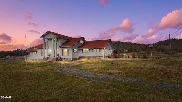 exterior space with a yard, crawl space, and an attached garage