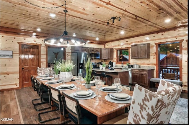 2623 Rogers Way, Sevierville, TN 37876 - dining area featuring wooden walls, a notable chandelier, wooden ceiling, and dark wood finished floors