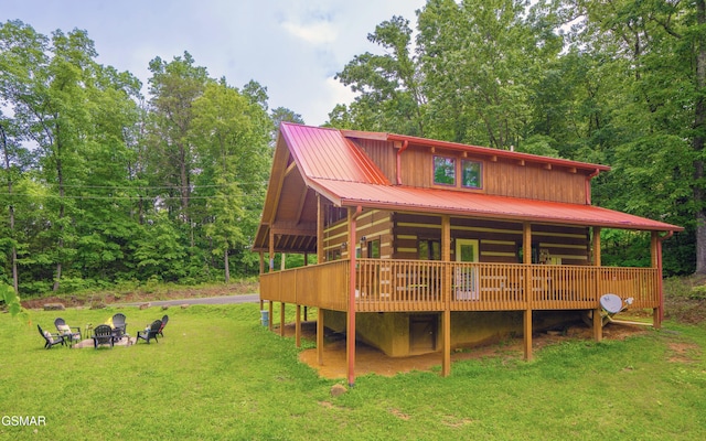 3510 Twin City Way, Pigeon Forge, TN 37863 - rear view of house with an outdoor fire pit, a yard, metal roof, and a deck