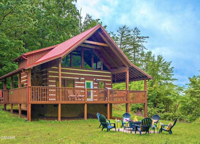 3510 Twin City Way, Pigeon Forge, TN 37863 - back of house featuring an outdoor fire pit, a deck, a lawn, and metal roof