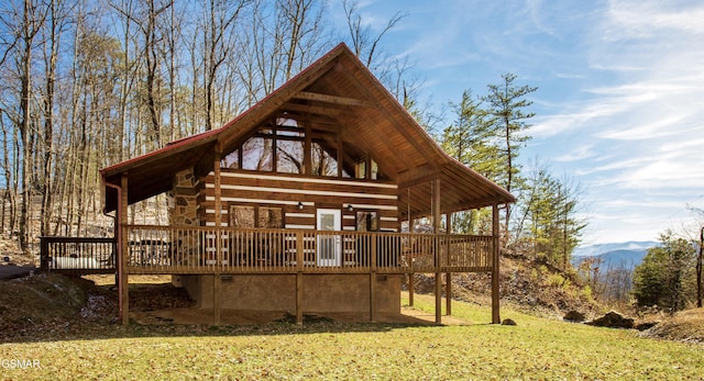 3510 Twin City Way, Pigeon Forge, TN 37863 - rear view of house featuring a deck with mountain view and a yard