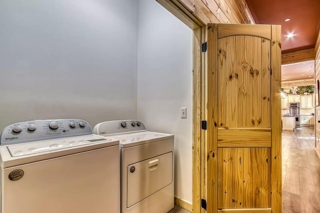 604 Cherokee Orchard Rd, Gatlinburg, TN 37738 - laundry area with washing machine and clothes dryer and light wood finished floors