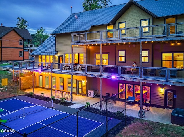 604 Cherokee Orchard Rd, Gatlinburg, TN 37738 - rear view of property featuring a balcony, a tennis court, a patio area, and metal roof
