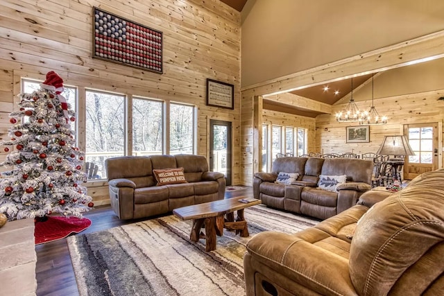604 Cherokee Orchard Rd, Gatlinburg, TN 37738 - living room featuring wooden walls, high vaulted ceiling, a chandelier, healthy amount of natural light, and wood finished floors