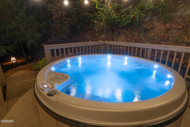 view of swimming pool featuring a hot tub