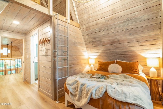 bedroom featuring wooden ceiling, wooden walls, and wood finished floors