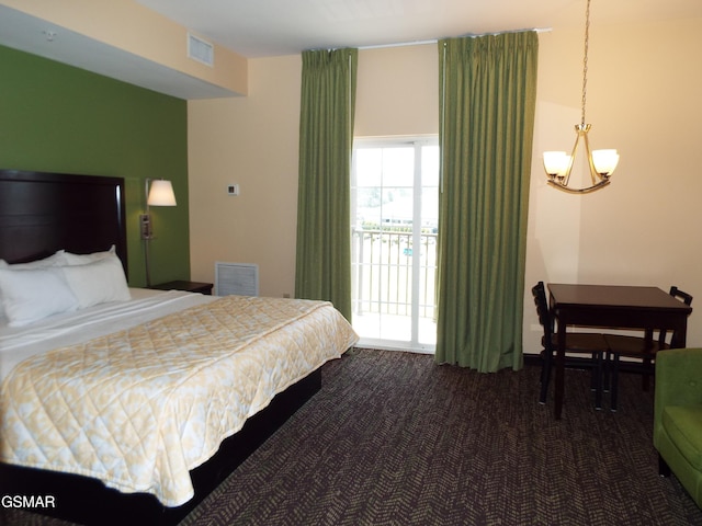 bedroom with a chandelier, dark colored carpet, visible vents, and access to exterior