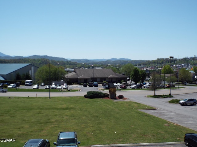 exterior space with street lights and a mountain view