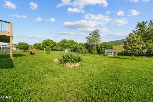 3206 Bativa Garden Ct, Sevierville, TN 37876 - view of grassy yard with a mountain view and a playground