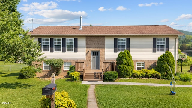 3206 Bativa Garden Ct, Sevierville, TN 37876 - raised ranch featuring brick siding and a front yard
