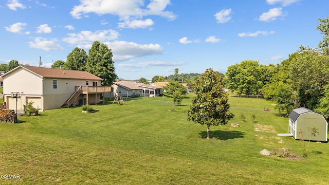 3206 Bativa Garden Ct, Sevierville, TN 37876 - view of grassy yard featuring stairway, an attached garage, and a deck