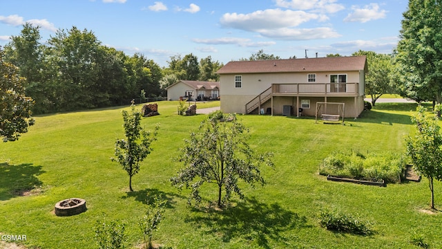 3206 Bativa Garden Ct, Sevierville, TN 37876 - rear view of house featuring a fire pit, a wooden deck, stairway, and a lawn