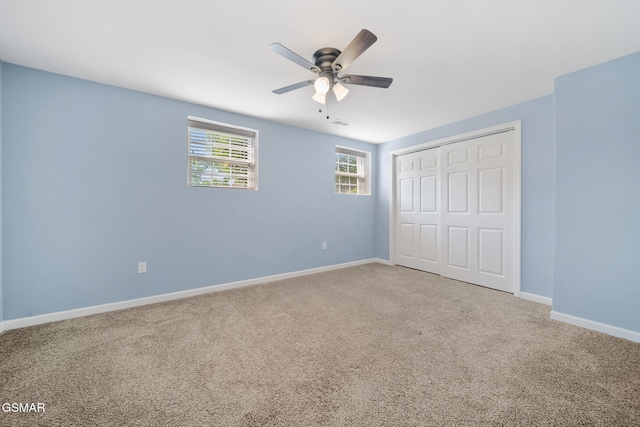 3206 Bativa Garden Ct, Sevierville, TN 37876 - unfurnished bedroom with carpet, a closet, baseboards, and ceiling fan