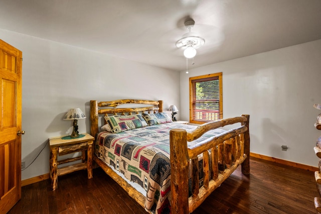 bedroom featuring ceiling fan and dark hardwood / wood-style floors