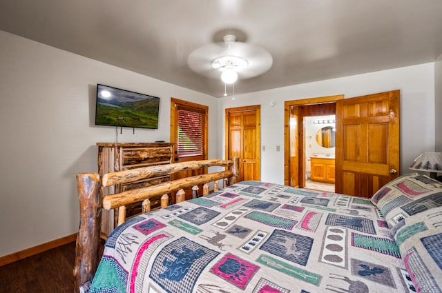 bedroom with ensuite bathroom, hardwood / wood-style floors, and ceiling fan