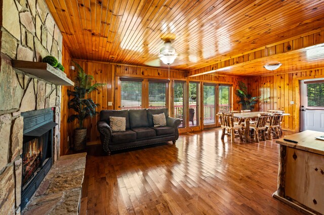 living room with a fireplace, hardwood / wood-style flooring, and a wealth of natural light