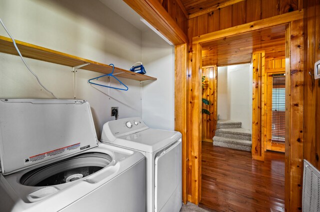 laundry room featuring dark wood-type flooring and washing machine and clothes dryer