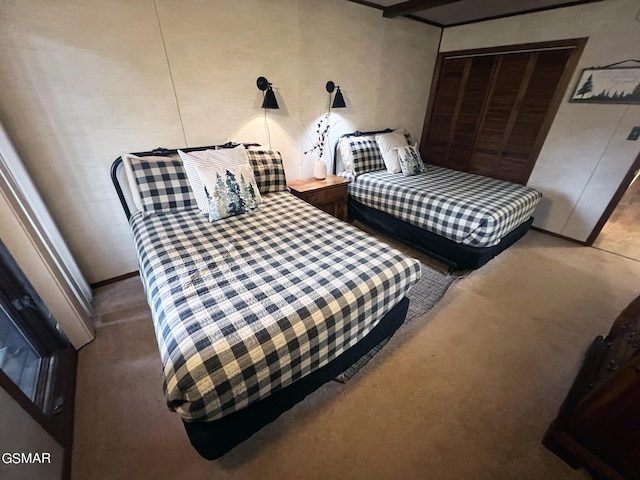 carpeted bedroom with a closet