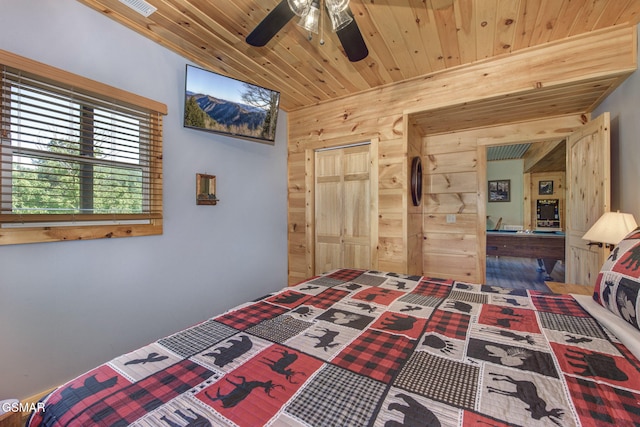 2319 Panther Way, Sevierville, TN 37876 - bedroom with wood walls, wood ceiling, and ceiling fan