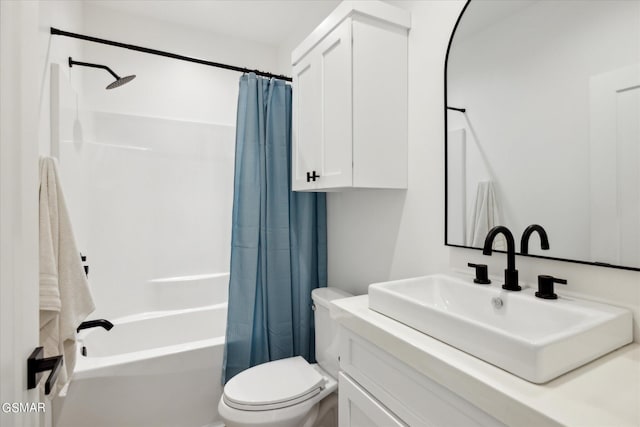 full bathroom with shower / tub combo with curtain, vanity, and toilet