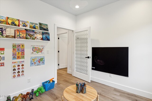 playroom featuring hardwood / wood-style floors