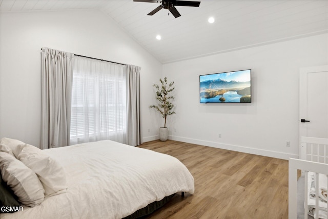 bedroom featuring ceiling fan, lofted ceiling, and hardwood / wood-style flooring