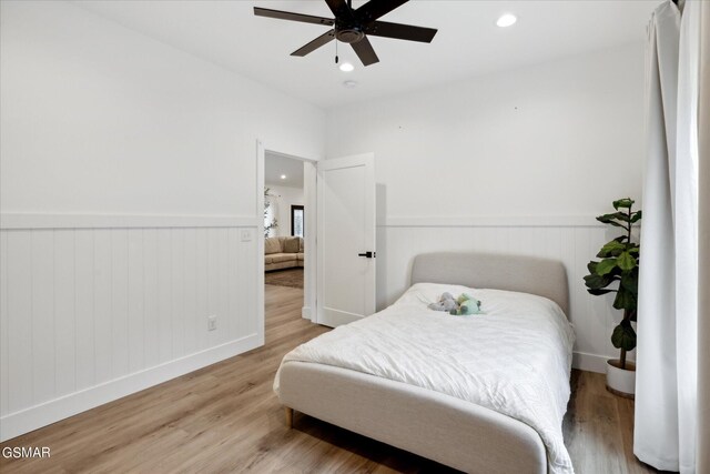 bedroom featuring hardwood / wood-style floors and ceiling fan