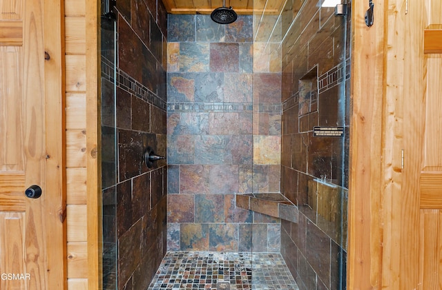 full bath featuring a tile shower