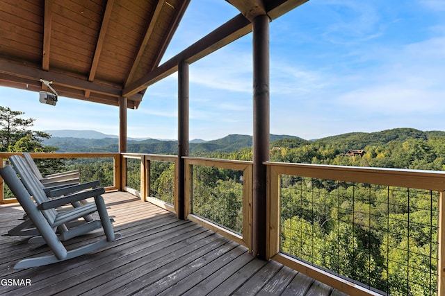 wooden deck featuring a mountain view