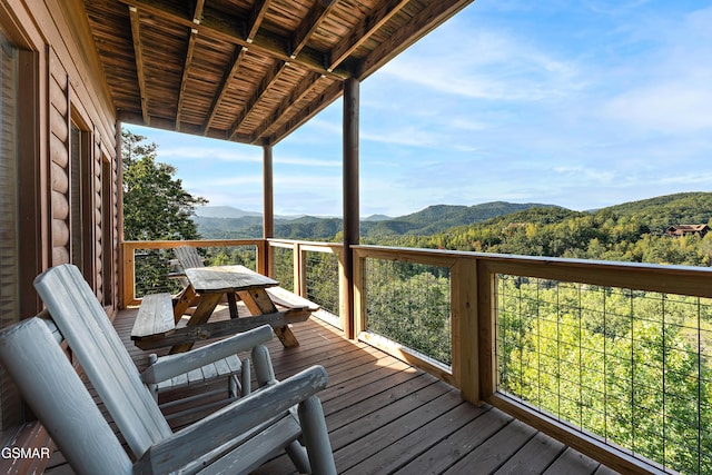 wooden terrace with a mountain view