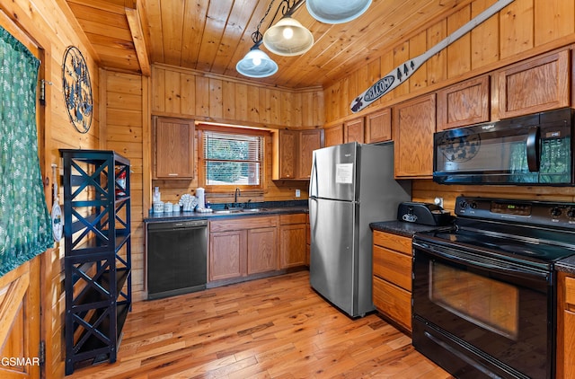 kitchen with dark countertops, black appliances, wooden ceiling, and brown cabinetry