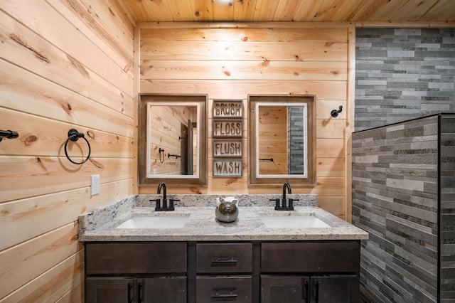 bathroom featuring vanity, wood walls, and wood ceiling