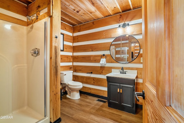 bathroom featuring wood ceiling, wood walls, a shower stall, and wood finished floors