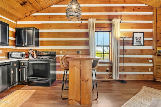 kitchen with dishwashing machine, black electric range oven, wood walls, and dark cabinetry