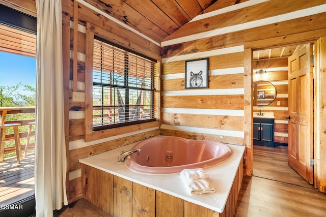 full bathroom with wooden walls, lofted ceiling, wooden ceiling, wood finished floors, and a whirlpool tub