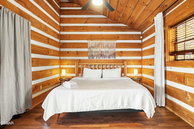 bedroom with lofted ceiling, wood walls, wood finished floors, and wood ceiling