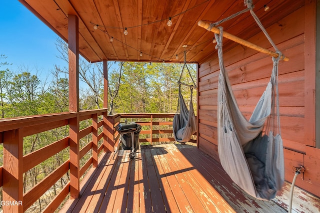 wooden terrace with area for grilling