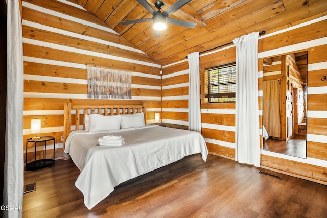 bedroom featuring lofted ceiling, wooden ceiling, visible vents, and wood finished floors